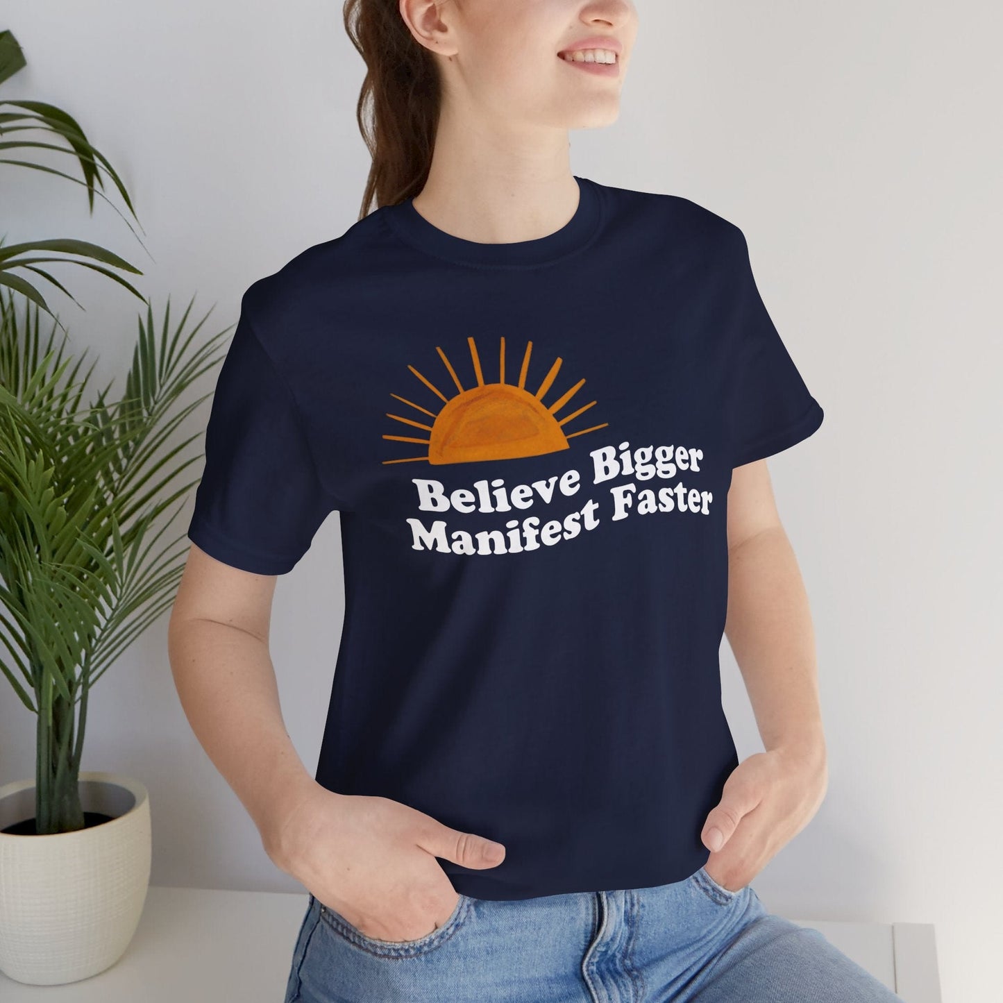 Believe Bigger Manifest Faster Unisex Short Sleeve Tee