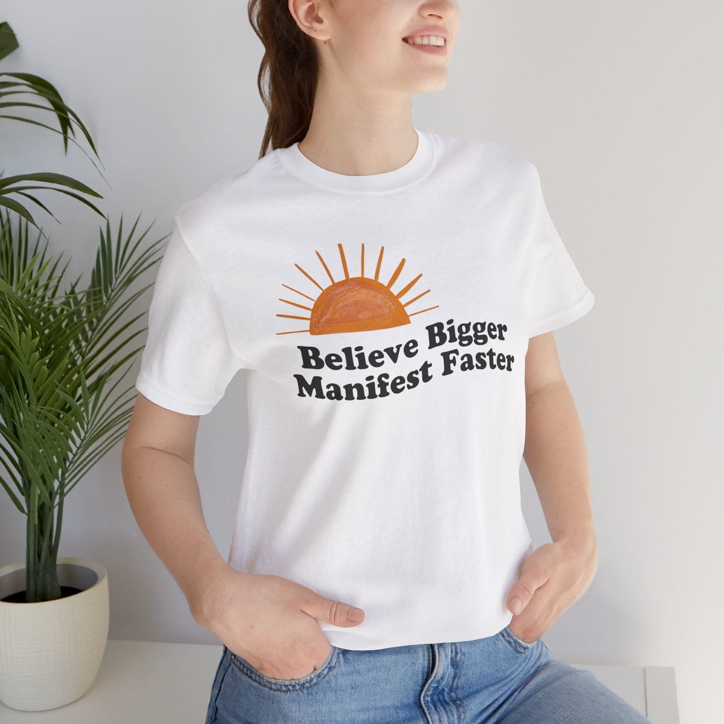 Believe Bigger Manifest Faster Unisex Short Sleeve Tee