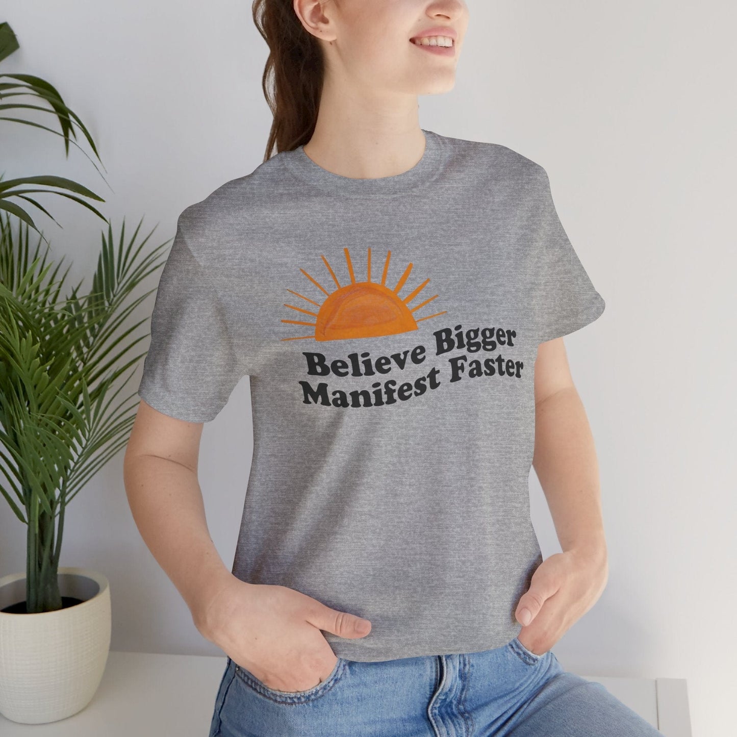 Believe Bigger Manifest Faster Unisex Short Sleeve Tee