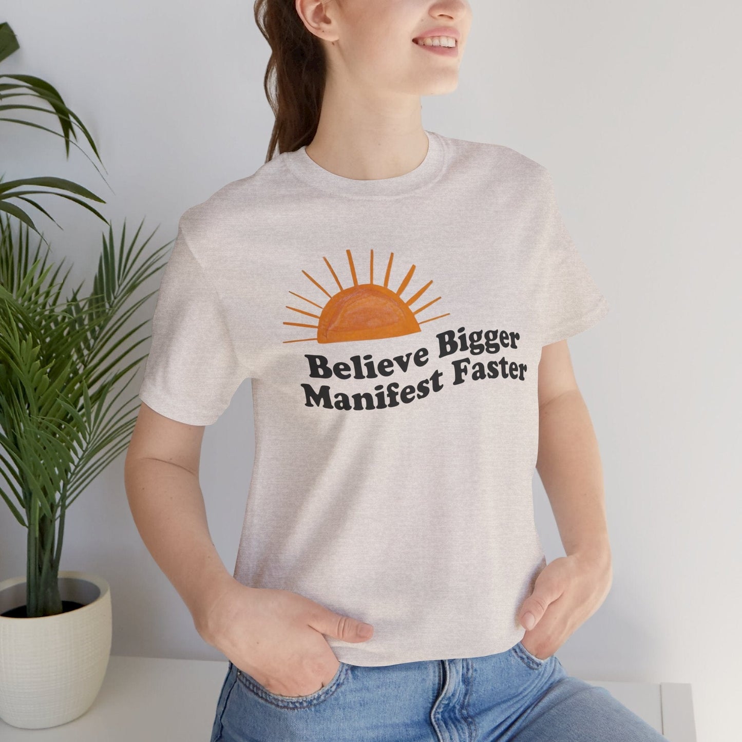 Believe Bigger Manifest Faster Unisex Short Sleeve Tee